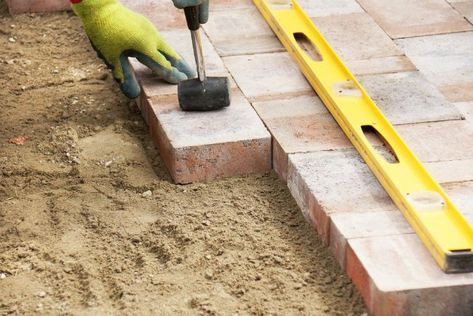 Fix sunken pavers not only because they're an eyesore, but also because they're a safety hazard. Here's how to handle the repair. How To Lay Pavers, Pavers Diy, Brick Paver Patio, Garden Pavers, Paver Blocks, Brick Laying, Paver Designs, Brick Walkway, Paver Walkway