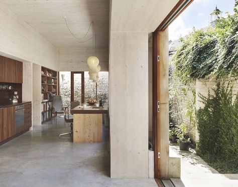 single-storey new-build tucked behind existing wall - Strange House - Hugh Strange Concrete Kitchen Floor, Polished Concrete Floor, Built In Bunks, Underfloor Heating Systems, Concrete Stairs, Victorian Buildings, Concrete Kitchen, The Modern House, Poured Concrete