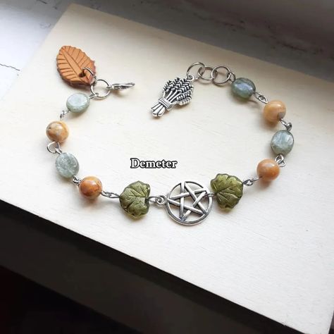 Deity dedication bracelets I make witchy style bracelets as well as deity bracelets, lots of styles and commissions are open! #bracelets #deity #deitytok #gemstonejewelry #commissionsopen #loki #fenrir #hermes #persephone #Dionysus #demeter Loki Fenrir, Witchy Designs, Witch Bracelet, Witchy Style, String Crafts, Witchy Fashion, Stone Bracelets, Natural Stone Bracelets, Prayer Beads