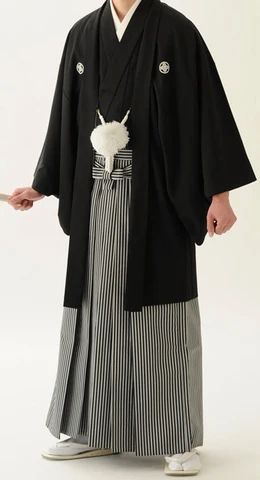 A hakama(袴) is the skirt-like pants that some Aikidoka wear. It is a traditional piece of samurai clothing. While hakama used to be a required part of men's wear, nowadays typical Japanese men usually wear hakama only on extremely formal occasions and at tea ceremonies, weddings, and funerals. Traditional Japanese Man Kimono, Kimono For Men Traditional, Japanese Traditional Dress Men, Japanese Wedding Kimono Men, Japanese Funeral Clothes, Japan Traditional Clothes Men, Japanese Outfits Traditional Male, Traditional Japanese Clothes Men, Traditional Japanese Mens Clothing