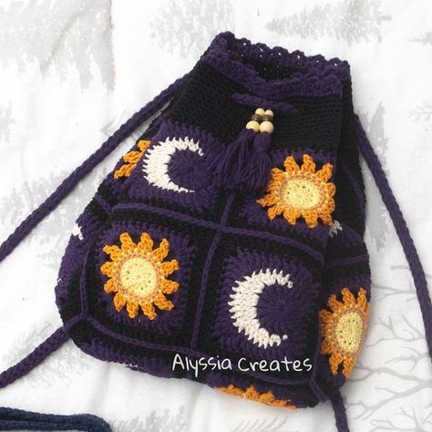 Alyssia on Instagram: "While I work on finishing new projects here’s another set of throwback projects; sun and moon backpack + crossbody bag! I have a million photos that I’ve never posted so here’s one of them😆 Patterns available in my bio link!" Crochet Sun And Moon Bag, Granny Square Backpack Free Pattern, Moon Crochet Bag, Starry Night Crochet, Star Crochet Bag, Crochet Bag Diy, Moon Backpack, Crochet Bag Tutorial, Star Crochet