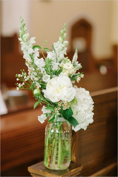 Mason jar floral arrangements to add decor to a traditional church ceremony setting. Floral Design: Ashley Elaine ---> http://www.weddingchicks.com/2014/05/12/are-you-a-camera-shy-bride-or-groom/ Jar Floral Arrangements, Flowers Arrangements Wedding, Mason Jar Flower Arrangements, White Floral Arrangements, White Flower Arrangements, Mason Jar Flowers, Wedding Church, Church Flowers, Mason Jar Wedding