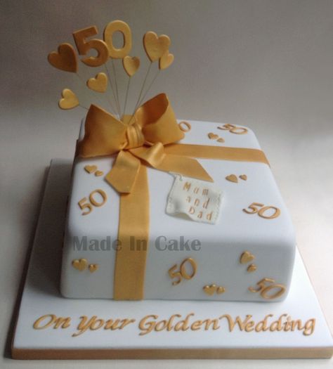 golden wedding anniversary cake Golden Wedding Cake, Golden Wedding Anniversary Cake, Three Tier Wedding Cake, Flower Cake Toppers, Wedding Anniversary Cake, Golden Wedding Anniversary, Horse Shoes, Engagement Cakes, Silver Ribbon