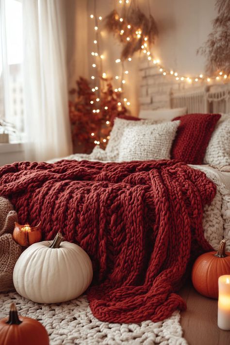 A cozy bedroom with a deep red chunky knit blanket draped over the bed. Fall Bedroom Decor, Cozy Fall Bedroom, Fall Bedding, Apartment Makeover, Fall Decor Ideas, Fall Bedroom, Autumn Decorating, Christmas Decorations Bedroom, Bedroom Red