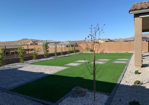 Gray paver, slate paver, artificial turf, Arizona beige rock, Indian laurel hedges Rectangle Pavers With Grass In Between, Arizona Turf Backyard, Backyard With Turf And Pavers, Paver Patio With Artificial Turf, Rectangle Backyard Ideas, Desert Landscaping With Artificial Turf, Arizona Backyard Ideas, Purple Plum Tree, Artificial Turf Backyard