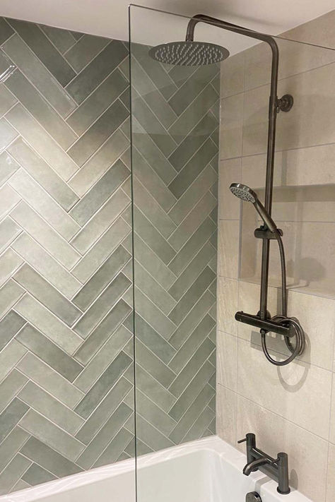 Vienna sage green brick wall tiles in a herringbone pattern featured as a shower splashback paired with Palermo ivory ceramic wall tiles Jade Shower Tile, Statement Tile Bathroom, Shower Tile Green, Sage And Grey Bathroom, Sage Green Tile Bathroom, Green Herringbone Tile Bathroom, Sage Green Bathroom Tiles, Green Herringbone Tile, Sage Green Tile