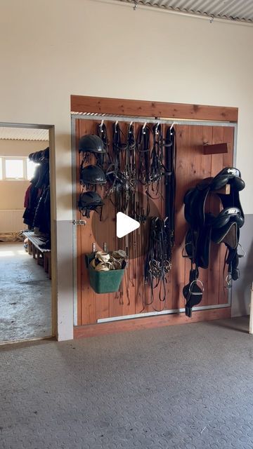 Hestaland on Instagram: "Our tack wall - easy access! 🐴 In the evening when we’re done for the day, we just flip it around and close the door so we have the tack room locked for the night. Super convenient 🤗 Most of our equipment is from @astund.is, we use their saddles, bridles and care products 🙏🏼 Our horses deserves the best! #stablehack #tackroom #stable #stabledesign #hack #equestrian #saddleroom #horses #barn #barnhacks" Tack Room Ideas, Small Horse Barns, Horse Tack Rooms, Equestrian Property, Barn Hacks, Farming Life, Stables Design, Tack Room, Bridles