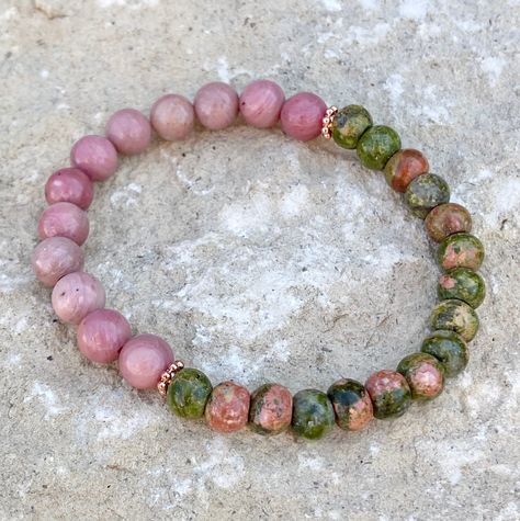 Round 8mm pink rhodonite beads with rondelle shaped unakite beads. Rose gold metal spacers, stretch bracelet. Pattern on beads may vary. Rhodonite Bracelet, Pink Rhodonite, Visually Pleasing, Artisan Bracelets, Beads Bracelet Design, Buy Crystals, Crystal Beads Bracelet, Bracelet Gemstone, Mineral Stone