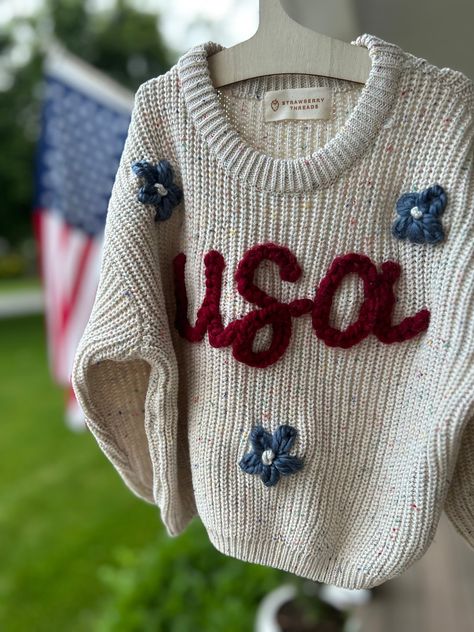 Customized Hand-Embroidered Name Sweaters -  stitched with love and attention to detail. USA design is perfect for 4th of July, flag day and memorial day!  SIZING: These sweaters are intentionally designed to be oversized. For a true-to-size fit, consider sizing down. MATERIAL: Sweaters are 100% Cotton ; please note, some of the yarn may contain wool.  YARN: When placing your order, kindly specify your preferred yarn color choice in the customization box (I have every color yarn under the sun and I will send you options if you would like me too, or a different ).  If no color preference is provided, I will contact you and give you 2 days to respond or I will move forward with using a neutral color that blends best. I'm happy to run with any design freedom you give me!!  SWEATER CARE: I rec Hand Embroidered Sweater, Embroidered Sweaters, Sweater Care, Sweater Designs, Miss Independent, Sweater Ideas, Usa Design, Flag Day, Kids Jumpers