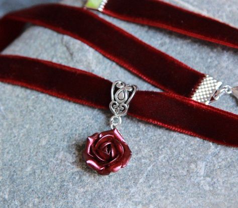 "Burgundy velvet choker - Ribbon choker necklace pendant - Polymer clay flower necklace Burgundy velvet ribbon choker with sculpted sparkly rose. Rose material is polymer clay with special strongcover. Each petal of flower made by hand without any mold Dia flower 13-15 mm/ 0.45-0.55 \" Length of necklace is adjustable: 10-12 inches/ 25,4 - 30,5 cm 11-13 inches/ 28-33 cm 12-14 inches/ 30.5- 35.5 cm 13-15 inches/ 33-38 cm 14-16 inches/ 35.5 cm-40.5 cm 15-17 inches/ 38,1 cm- 43,2 cm 16-18 inches/ 4 Maroon Necklace, Ribbon Choker Necklace, Lizzie Hearts, Red Choker, Ribbon Choker, Red Pearl, Ribbon Necklace, Clay Flower, Burgundy Velvet