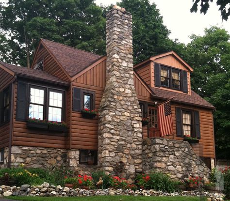 Primitive log cabin with a country cape style. Chimney field stone flowers shutters flags Cabin Shutters, Brown Shutters, Log Cabin Exterior, Cabin Remodel, Stone Flowers, Cabin Renovation, Forest Life, Log Cabin Interior, Adams Homes