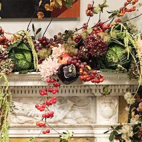 Shane Connolly & Co on Instagram: "Season of mists and mellow fruitfulness? We have it covered in this mantle garland… it’s a beautiful Grinling-Gibbons-inspired pile up of seasonal fruit and veg. With seasonal flowers too. We made a base garland of foliage and dried hydrangeas and added the fancy extras in situ, to avoid a fruit salad on the carpet. And hardly need to say it but #nofloralfoam #shaneconnollyandco #grinlinggibbonsinspired #seasonalflowers #mantlescape #fruitandveg #beyondflowers" Dried Fruit Garland Fireplace, Dried Fruit Christmas Garland, Orange Peel Mushroom Garland, Dried Fruit Fall Garland, Beaded Fruit Christmas Garland, Mantle Garland, Seasonal Fruit, Dried Hydrangeas, Christmas Fruit