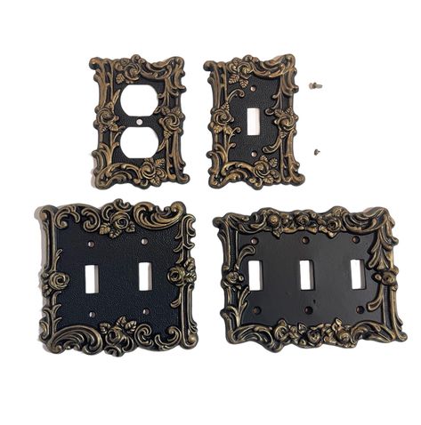 🖤DESCRIPTION: Gorgeous antique switch covers turned Gothic with black and gold.  A vintage brass switch cover has been painted flat black and then accented with European Gold metallic wax.  The switch plate has been covered in a top enamel coat. Each cover will come with the appropriate screws. CHOOSE OPTIONS UNDER VARIATIONS. 🖤DIMENSIONS: A - 2 hole outlet cover - Height - 5" x Width - 3 1/4" B - single light switch cover - Height - 5" x Width - 3 1/4" C - double light switch cover - Height - Gothic Light Switch Covers, Victorian Light Switches, Gold Light Switch Cover, Antique Light Switch, Gothic Hardware, Black Light Switches, Antique Fixtures, Black And Gold Decor, Gothic Homes