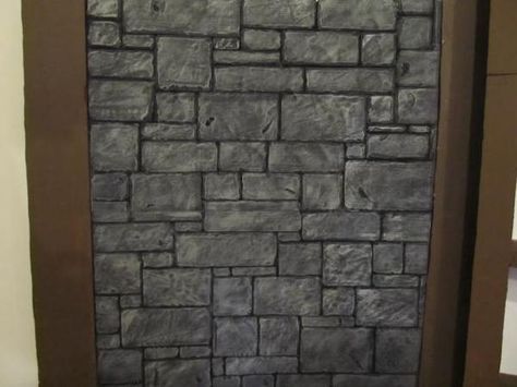 The completed foam wall Foam Board Crafts, Shrek Jr, Foam Carving, Faux Stone Walls, Medieval Party, Diy Props, Foam Panels, Castle Wall, Stone Walls