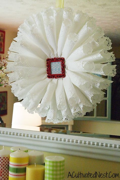 diy paper doily wreath from A Cultivated Nest Rolled Paper Wreath, Doily Wreath, Paper Doily Crafts, Book Wreath, Doily Wedding, Doilies Crafts, Paper Wreath, Pretty Wreath, Paper Doilies