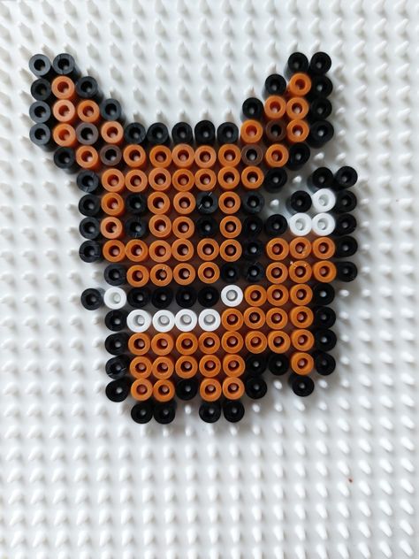 Strijkkraal patroon eevee Pikachu Perler Bead Pattern, Eevee Pixel Art, Pokémon Perler Beads, Iron Beads Ideas, Pikachu Hama Beads, Perler Bead Pokemon Patterns, Melty Bead Designs, Melt Beads Patterns, Pokemon Bead