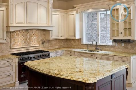 A truly unique island can really make the room and this one lends an old fashioned touch to the room. Of course, antique white cabinets give it an old world look as well. Cream Bathrooms, Kitchen Colors With White Cabinets, Gold Granite Countertops, Yellow Granite, Venetian Gold Granite, Antique White Cabinets, Airy Kitchen, Granite Kitchen Counters, Top Kitchen Cabinets