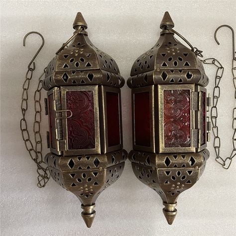 PRICES MAY VARY. --- Set of 2 candlestick holder: You will receive one parcel contain two pieces vintage gold candlestick lanterns --- candle lantern size: High 9.45Inch width 3.54Inch and with 13.8Inch hanging chain Including hook. (Candle do not included) ---The hanging lantern color: Vintage Bronze gold with Embossed clour glass, It will show three colors in different angles.(Red, purple and yellow )) ---Candlestick lantern material: They made of high quality iron with glass, These lanterns a Mexican Lanterns, Hanging Lanterns Bedroom, Random Decorations, Whimsigoth Wedding, Samhain Decorations, Gatsby Decor, Stained Glass Lantern, Candle Hanging, Kawaii Room Ideas