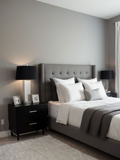 Create a chic and modern look by painting one wall in your bedroom a light gray color. Pair it with a sleek and minimalist black or white bed frame, and accessorize with metallic accents for a touch of elegance. Light Gray Accent Wall, Light Grey Bed Frame, Grey Bed Frame Bedroom Ideas, Silver Bedside Table, Gray Accent Wall, Light Grey Bed, Gray Upholstered Bed, Black Bedside, Grey Bed