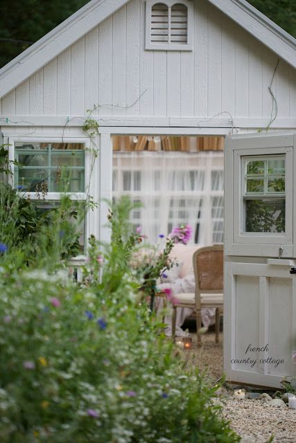 An inspired little spot- French Country Cottage She Shed -  Warm summer evenings    and twinkle lights?   They pretty much just go together.        And sprinkle them with a little bit of cottage char... Cottage She Shed, Shabby Chic She Shed, Backyard Art, Garden Houses, Greenhouse Shed, Pond Life, Potting Sheds, She Sheds, Granny Flat