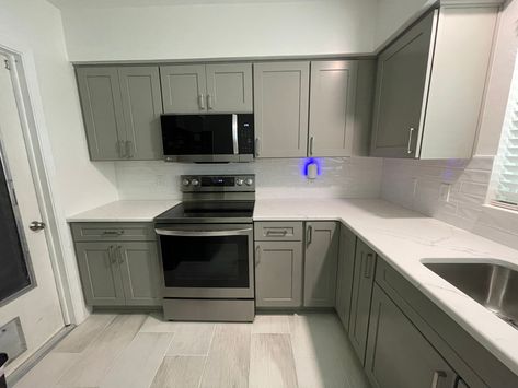 The cabinets were done in the Catalina door in birch and a pebble grey color. Pebble Grey, Grey Kitchen Cabinets, Kitchen Cupboard, Grey Cabinets, Transitional Kitchen, Grey Kitchens, Grey Kitchen, Kitchen Remodeling, Kitchen Remodel Idea