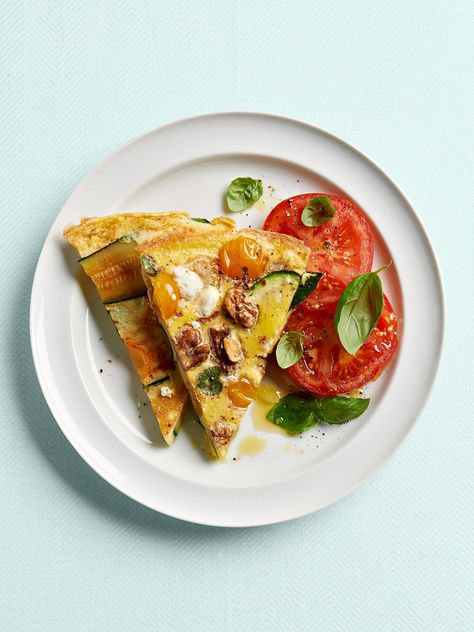 zucchini-tomato-frittata-RU284268 Mediterranean Breakfast Recipes, Vegetable Frittata Recipes, Zucchini And Tomato, Tomato Frittata, Easy Mediterranean Recipes, Breakfast Skillet Recipes, Mediterranean Diet Breakfast, Mediterranean Breakfast, Vegetable Frittata