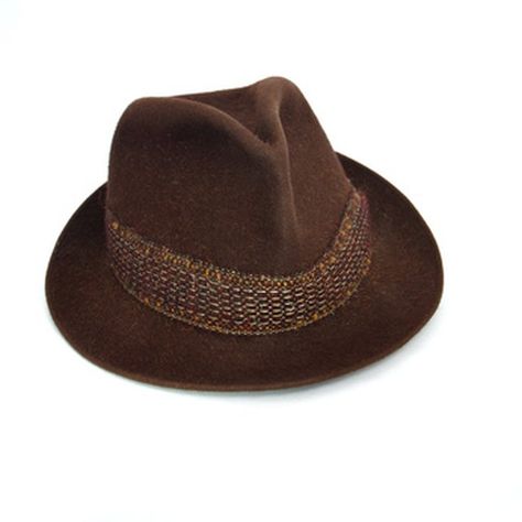 Store-bought fedoras can be expensive and the range of styles may be limited. You can make your own fedora at home, however, using inexpensive supplies such as felt and white glue. Diy Fedora Hat, Horse Hair Hat Band, Irish Clothing, Zoot Suit, Hat Patterns Free, Trendy Hat, Nurse Hat, Felt Fedora, Diy Hat