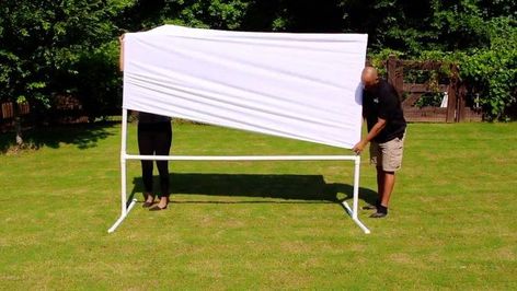 Make your very own outdoor movie theatre. This DIY PVC Pipe Movie Projector Screen is very easy to make, and great for FUN movie nights with your friends, and family. EASY as 1,2,3!!! You're going to need (4) 1 1/2in X10FT PVC Pipes, (6) 1 1/2 in Tees, (2) 1 1/2in Elbows, (4) 1 1/2in Caps(Optional), & a King Size King Sheet. Fold Sheet in Half. Use a 8Ft Pipe (Top of Screen) with attached Elbows to measure the Width of the Screen. Cut excess Material. Glue the Left &… Diy Backyard Movie Theater, Diy Backyard Movie, Diy Outdoor Movie Screen, Backyard Movie Theaters, Outdoor Movie Theater, Outdoor Movie Screen, Backyard Movie Nights, Outdoor Projector, Backyard Movie