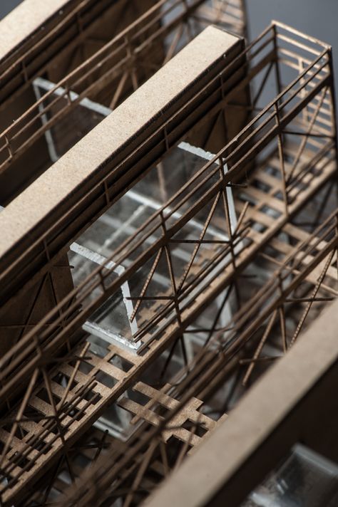 Live/Work Infrastructure Incubator by Ryan Orr. The design internally exposes the building’s infrastructure in order to provide access to the systems for the researchers. Scaffolding, the infrastructure of masonry building, also remains assembled. Utilizing this infrastructure, space is created for the researcher’s activity. Model: Chipboard. Photography Credit: Andrew Kahl. Chipboard Architecture Model, Scaffold Exhibition Design, Masonry Building, Scaffolding Exhibition, Bamboo Scaffolding Architecture, Scaffolding Installation, Scaffolding Parts, Architectural Models, Portfolio Ideas