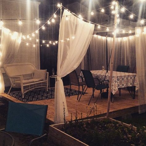 My new floating deck oasis.  #floating #deck #globelights #outdoor #curtains #living Floating Outdoor Curtains, Floating Curtains Outdoor, Deck Curtains, Deck Oasis, Privacy Lattice, Porch Privacy, Outside Oasis, Rv Redo, Deck Makeover