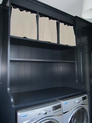 an old cabinet and built it into the wall. The cabinet fits a washer and dryer below with practical shelving above. Dark Laundry, Laundry Idea, Laundry Room Colors, Old Cabinets, Laundry Closet, Traditional Interior Design, Washer Dryer Combo, Design Books, House Of Windsor