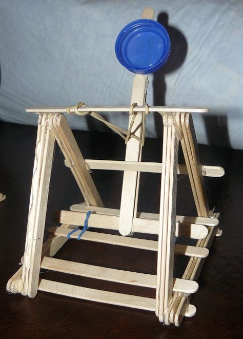 Plan A:  craft stick and rubber band catapult (We shoot either mini smooshmallows or fuzzies for ammo.) Catapult Project, Diy Catapult, Popsicle Stick Catapult, Coca Cola Can, Cub Scout, Popsicle Stick, Cub Scouts, Popsicle Sticks, A Craft