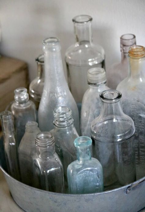 How To Put Collections On Display · Cozy Little House Glass Bottle Collection Display, How To Display Old Bottles, Old Bottle Display Ideas, Display Bottle Collection, Bottles Display Ideas, Old Glass Bottles Ideas Display, Displaying Bottles Ideas, Decorating With Old Glass Bottles, Jar Collection Display Ideas