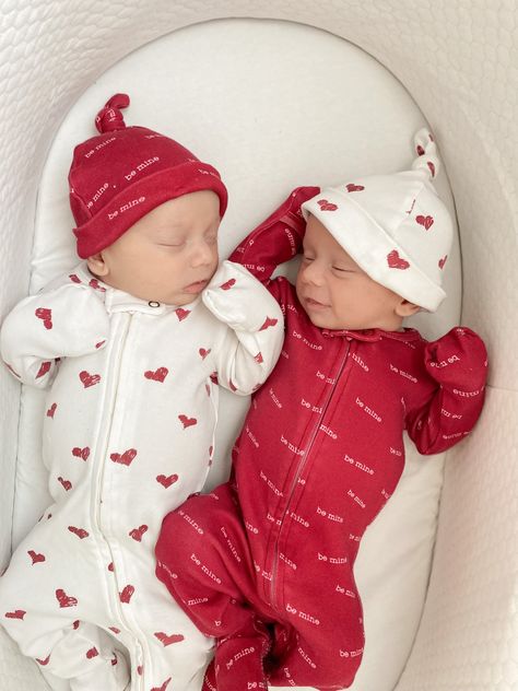 Two babies laying together in basket. One wearing L'ovedbaby Valentine's Day collection 2-way Zipper Footie in Be Mine print, the other in Crimson Hearts print. Sensory Exploration, Tactile Stimulation, Knotted Top, Swim Cap, Twin Outfits, Newborn Twins, Baby Nest, Tiny Things, Organic Baby Clothes