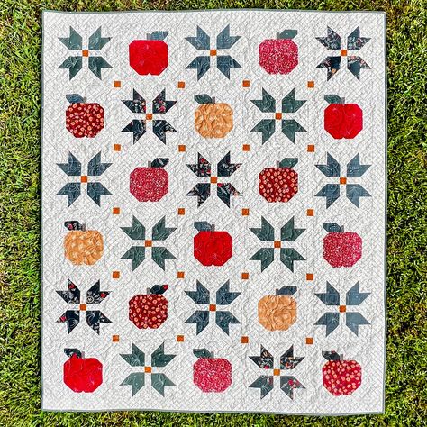 Crisp, cool air brings beautiful autumn leaves and delicious apples! Apple cider, apple butter and apple pie are staples of the fall season. This quilt features New England quilt blocks nestled with apples. Apple Butter Days quilt is sure to make your home and the shorter days cozier! 3 Sizes - 53" x 63", 73" x 83" and 93" x 103" Recommended for Intermediate Level Quilters. Traditional Piecing. YouTube Video available for this quilt on our YouTube Channel - https://www.youtube.com/channel/UC9qwP7DoT86BB1CFTeTKrrQ Pictures feature Seasons and Spice Fabric Collection by Art Gallery Fabrics Apple Quilt, Fall Quilt Patterns, Half Square Triangle Quilts, Easy Quilt Patterns, Fall Quilts, Fall Apples, Triangle Quilt, Precut Fabric, Traditional Quilts