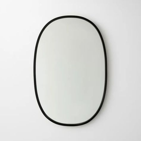 Hub Black Oval Wall Mirror 18" x 24" | Unison | Oval mirror, Oval wall mirror, Oval mirror bathroom Oval Bathroom Mirror, Oval Vanity Mirror, Large Wall Shelves, Black Wall Shelves, Oval Mirror Bathroom, White Wall Shelves, White Bath Mat, Modern Bathroom Accessories, Black Bowl