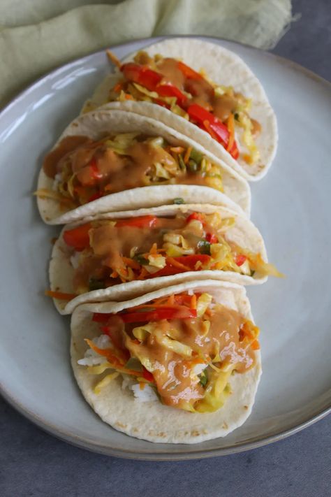 These unique Thai veggie tacos are a fun and easy fusion food you can make for dinner in about 20 minutes. Magical Food, Asian Fusion Recipes, Fusion Recipes, Veggie Tacos, Food Fusion, Seasoned Veggies, Month May, Vegetarian Cabbage, Cheat Meal