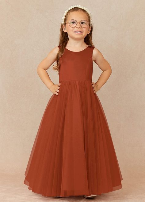 Muni is our adorable flower girl dress cut from satin and tulle. She features a scoop neckline paired with a heart shaped back cutout and cover button closure. The look is complete with an A-line skirt. Rust Junior Bridesmaid Dresses, Flower Girl Fall Dresses, Terracotta Flower Girl Dress, Burnt Orange Flower Girl Dresses, Fall Flower Girl Dresses, Girls Fall Dresses, Color Terracota, Burnt Orange Dress, Flower Girl Dresses Tulle