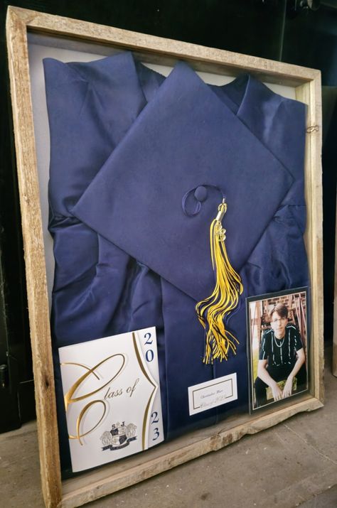 Graduation Cap Display Ideas, Shadow Box Cap And Gown, Cap And Gown Storage Ideas, How To Store Graduation Cap And Gown, What To Do With Cap And Gown After Graduation, Graduation Gown Shadow Box Ideas, Hat Shadow Box Ideas, Cap And Gown Keepsake Ideas, Shadow Box Graduation High Schools