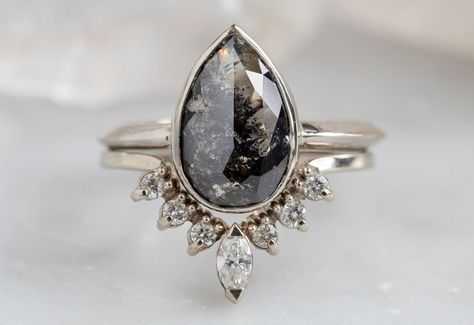 The Hazel Ring with a Black Pear-Shaped Diamond | Future engagement rings, Black diamond ring engagement, Dream engagement rings Black Moonstone Ring, Unique Wedding Rings Boho, Engagement Rings Black Diamond, Bohemian Engagement Ring, Engagement Rings Black, Creative Engagement Rings, Alexis Russell, Pave Wedding Bands, Rings Black