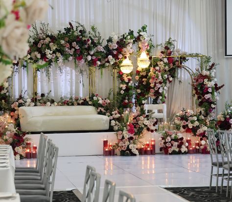 Filled with lush flowers and candles, the wedding reception for Maha & Wazir featured a stunning reception stage design 💕 Styling, flowers, decor, chandeliers and set up by @museweddingsandevents Candles by @rosewood.candles Photos by @picturethis.photographysydney Venue @manoronelizabeth Styling Flowers, Reception Stage, Flowers And Candles, Enchanted Garden Wedding, Garden Wedding Reception, Flowers Decor, Wedding Stage Decorations, Stage Decorations, Enchanted Garden