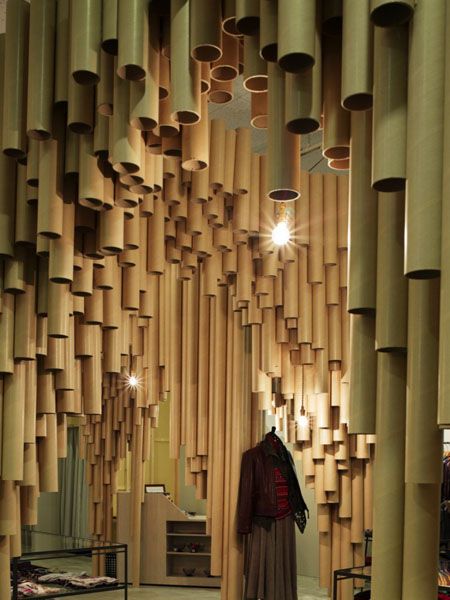 I love how the tubes have been suspended from the ceilings and how they're used for an unusual method of division of space. Clever! | #Cardboard Tubes | The Resource Exchange Vitrine Design, Cardboard Sculpture, Tube Design, Deco Studio, Kunst Inspiration, Cardboard Art, Cardboard Tubes, Green Style, Cardboard Furniture