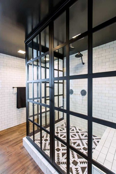 Black framed glass shower enclosures, with their modern and industrial flair, are gaining in popularity. Check out these beautiful examples. Framed Shower Doors, Modern Shower Doors, Industrial Showers, Coastal Shower Doors, Bathroom Shower Accessories, Bathroom Shower Panels, Framed Shower Door, Shower Renovation, Custom Tile Shower