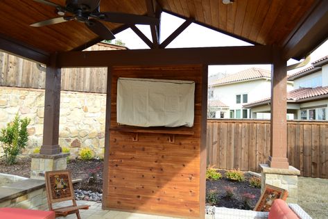 The interior of this custom cabana includes a custom cedar TV wall and cedar mantel. Gazebo Tv Ideas, Patio Tv, Tv Ideas, Outdoor Covered Patio, Patio Fireplace, Patio Deck Designs, Backyard Gazebo, Deck Designs Backyard, Patio Wall