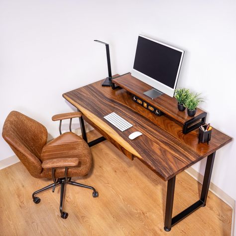 Live Edge Desk - Ships Next Business Day For Free. Transform your workspace with our Computer Desk, designed for elegance and functionality. Perfect for work-from-home setups and office environments, this Walnut Desk blends natural beauty with practical features. Key Features: ∙ Premium Material: Made from solid walnut wood, this desk showcases a unique natural live edge, making each piece one-of-a-kind. ∙ Customization Options: Choose between different size options, a desk with drawer, or a desk shelf to suit your needs. **Please note 30in desk doesn't come with adds-on" ∙ Handmade Quality: Expertly handcrafted, ensuring meticulous attention to detail and superior craftsmanship. ∙ Natural Live Edge: Each wood desk features a natural live edge, adding a touch of nature to your workspace. ∙ Desk With Shelf, Computer Desk With Drawers, Live Edge Desk, Computer Stand For Desk, Live Edge Design, Desk With Keyboard Tray, Desk With Drawer, Walnut Desk, Computer Desks For Home