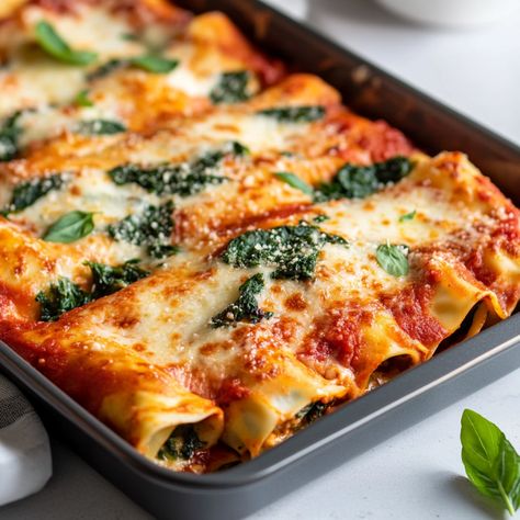 Cannelloni originated in Italy and dates back to the early 20th century. This dish became popular in Tuscany and Campania, where it was traditionally made with sheets of pasta rolled around various fillings, like meat, cheese, and vegetables.   #CannelloniPerfection #VegetarianDelights #CheesyGoodness #ItalianFlavors #ComfortFood #EasyDinner #SpinachLovers #CottageCheeseCannelloni #BakedPasta #FamilyMeal Spinach And Cottage Cheese, Tuscany Food, Cannelloni Pasta, Christmas Meal, Pasta Bake, Cottage Cheese, Early 20th Century, Easy Dinner, Family Meals