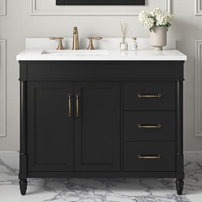 Designed with timeless details like brass hardware, spindle legs, and shaker doors, the vanity by Ove Decors will give your bathroom a fresh update that will never go out of style. Smartly appointed drawers and a spacious cabinet offer plenty of storage for daily essentials while a space-saving left-offset sink maximizes usable counter space. This vanity's shiny engineered marble countertop and undermount sink are ready to wow you with their ease of care, durability, and great looks. Base Finish 42" Vanity Bathroom, Black Vanity Bathroom Ideas, Gold Hardware Bathroom, Black And Gold Bathroom Vanity, Black Vanities, Bathroom Vanity Single Sink, Vanity In Bathroom, Black Bathroom Vanity, Condo Renovation