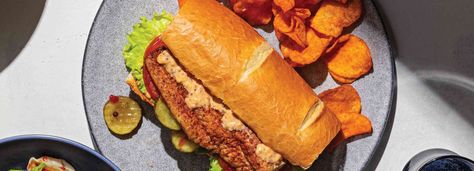 If Louisiana were a sandwich, it would be this Cajun Catfish Po’ Boy. Cajun Catfish, Blackened Catfish, Louisiana Hot Sauce, Spicy Pickles, Blackened Seasoning, Pickle Chips, Ground Mustard, Tartar Sauce, Sliced Tomato