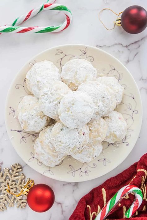 These peppermint snowballs are made with candy canes and bring the festive to any party or holiday gift tray! Nothing says Christmas cookie like snowballs! #Snowballs #peppermint #candycane #Christmascookies Peanut Butter Cornflake Cookies, Pecan Balls, Snowballs Recipe, Christmas Cookie Exchange Recipes, Peppermint Dessert, Caramel Apple Cookies, Creamed Spinach Recipe, Peppermint Recipes, Cookie Exchange Recipes