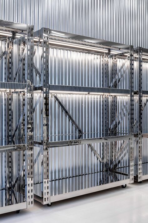 Virgil Abloh and AMO design flexible flagship Off-White store in Miami Off White Store, Corrugated Wall, Corrugated Metal Wall, Stainless Steel Shelving, Moveable Wall, Movable Walls, Basalt Stone, White Concrete, Stained Concrete